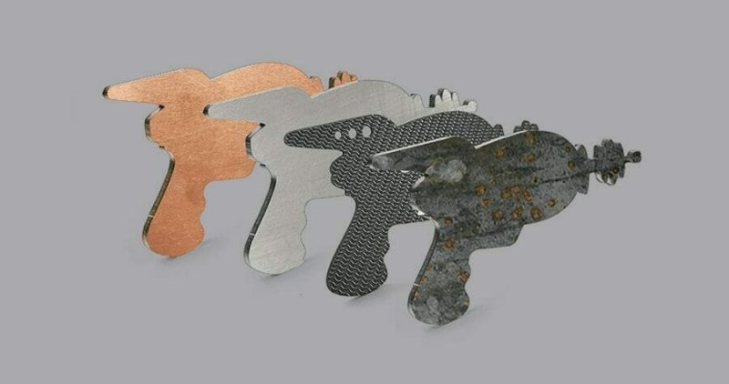 Image of 4 SendCutSend laser guns cut in different materials
