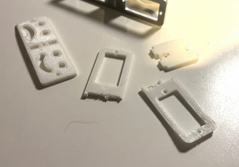 Image of a small 3D printed design in pieces on a table